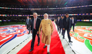 Prime Minister Narendra Modi waves to a massive gathering of around 30,000 members of the Indian diaspora at a community event in Melbourne, Australia.